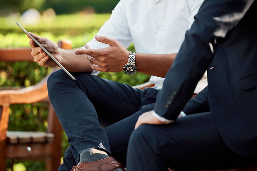 Two Man are Discussing and using iPad